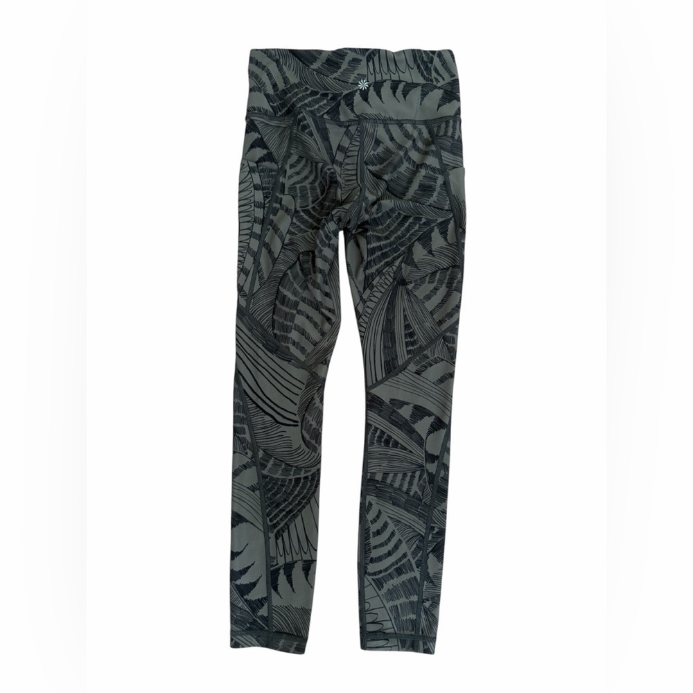 Athleta Salutation 7/8 Stash Pocket Leggings in a gray palm leaf print.
